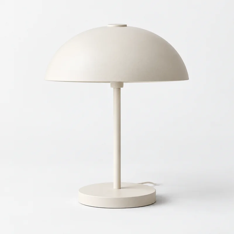 Halo Table Lamp in Ivory, isolated on a pale studio background